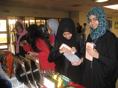 Students admiring fairtrade recycled gifts at the Preston University Ajman, visited May 2012 by Sabeena Ahmed The Little Fair Trade Shop