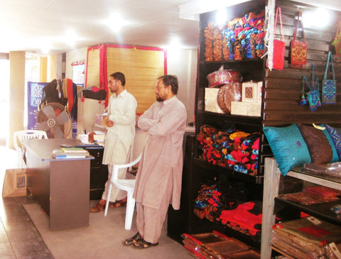 The Al Falah Trust and Embroidery Project Shop and sales team with Sabeena Ahmed