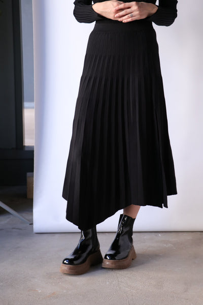 Simkhai Arianna Compact Rib Pleated Skirt in Black | WE ARE ICONIC