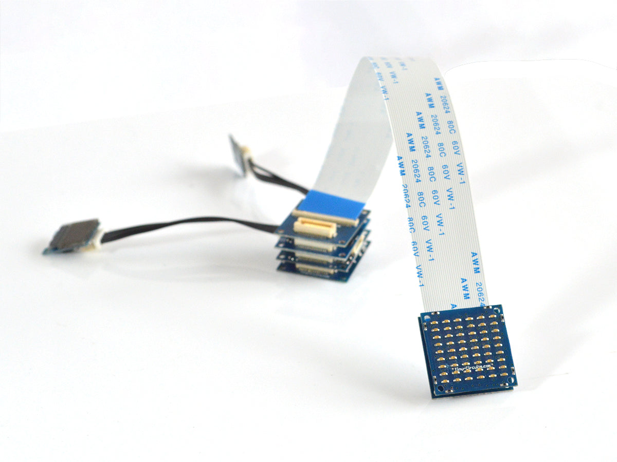 ribbon cable extender attached to one matrix LED board, and then attached to a stack of several boards on the other side