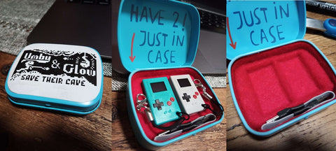 Three pictures edited next to each other, showing the outside of the case with an Umby & Glow sticker, the pictured inside has red felt material that is git to hold two Thumbys. The mint case reads "Have 2! Just in case"