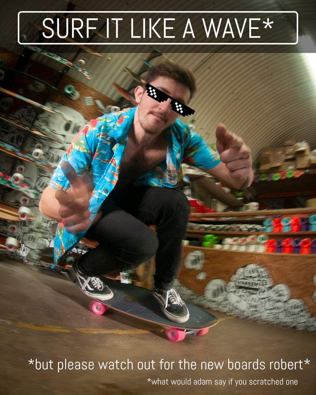 Rob riding a surfskate round the shop