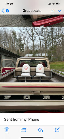 White bucket style truck bed seats with custom logo.