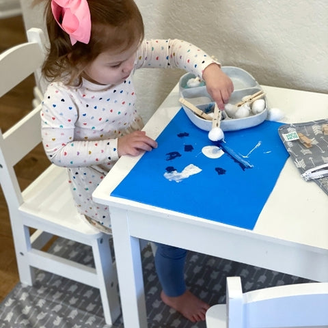 toddler doing easy craft activity