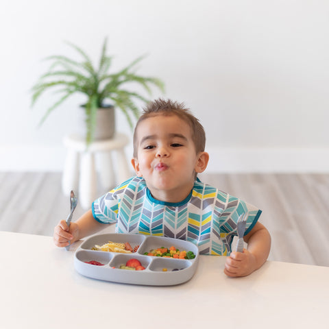 boy eating from 5-section divided children's plate