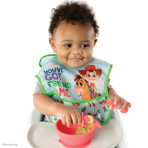 baby eating guacamole from a silicone baby bowl