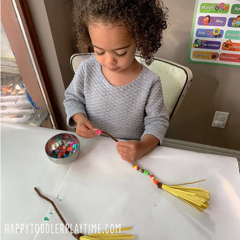 toddler making halloween crafts 