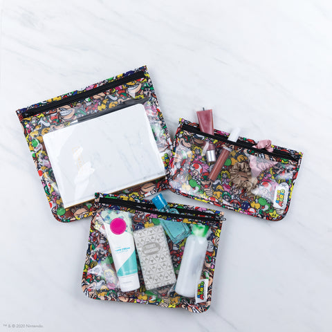 clear travel bags with mario print fabric on back holding travel  toiletries 