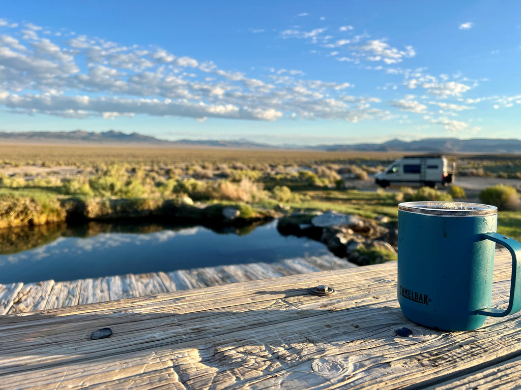 Remote camping spot with coffee mug