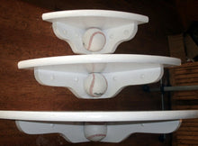 Corner shelves with baseballs