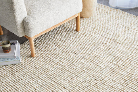 Bleached Jute Rug Styled in Living Room With Boucle Chair