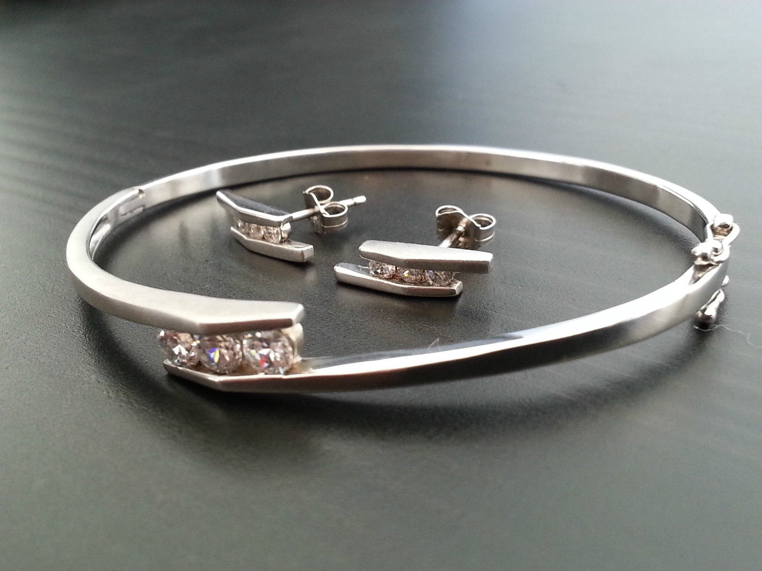 Modern Sterling silver set bangle and earrings with Cubic Zirconia sto ...