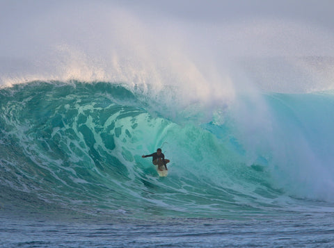 surf photographer and lifeguard getting barreled