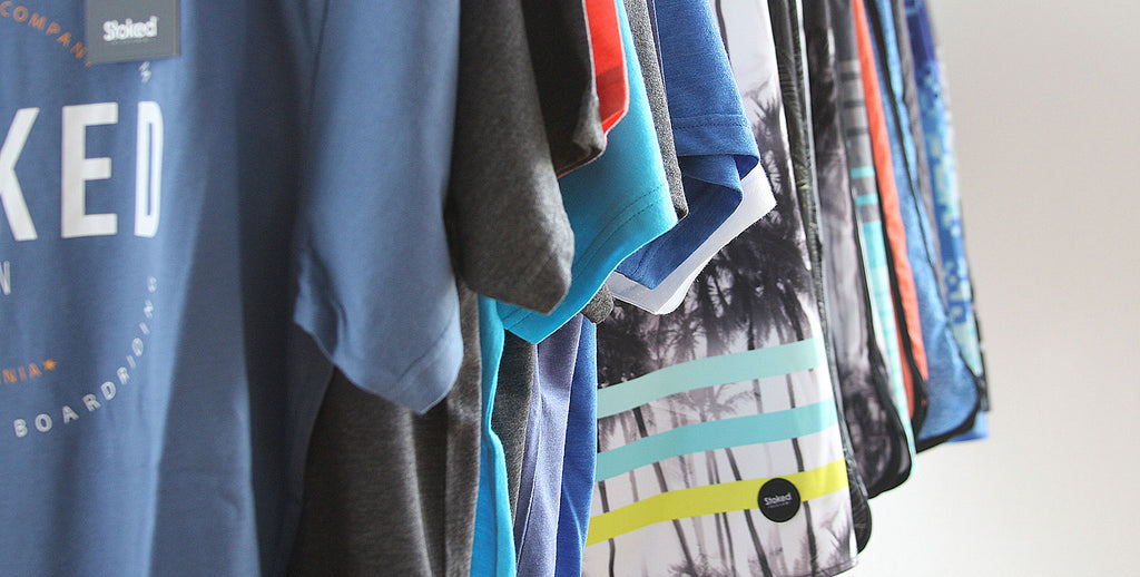 Stoked Vision tees and board shorts rack