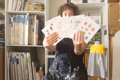 woman sitting holding decals