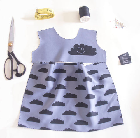 cloud dress flay lay with scissors and sewing tools