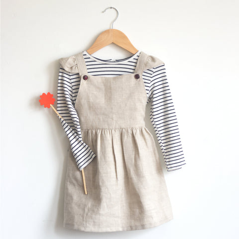pinafore dress with striped shirt and red flower