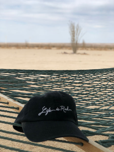 The Life's Rad Script Dad Hat will be the perfect gift for the those sunny beach days this summer.