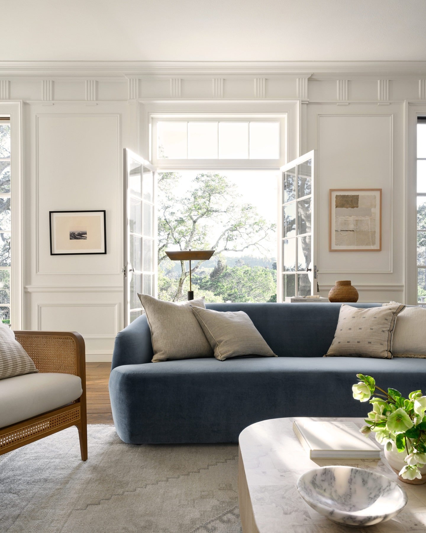 5. Crisp White Moulding and Slate Upholstery - blue and gray living room ideas