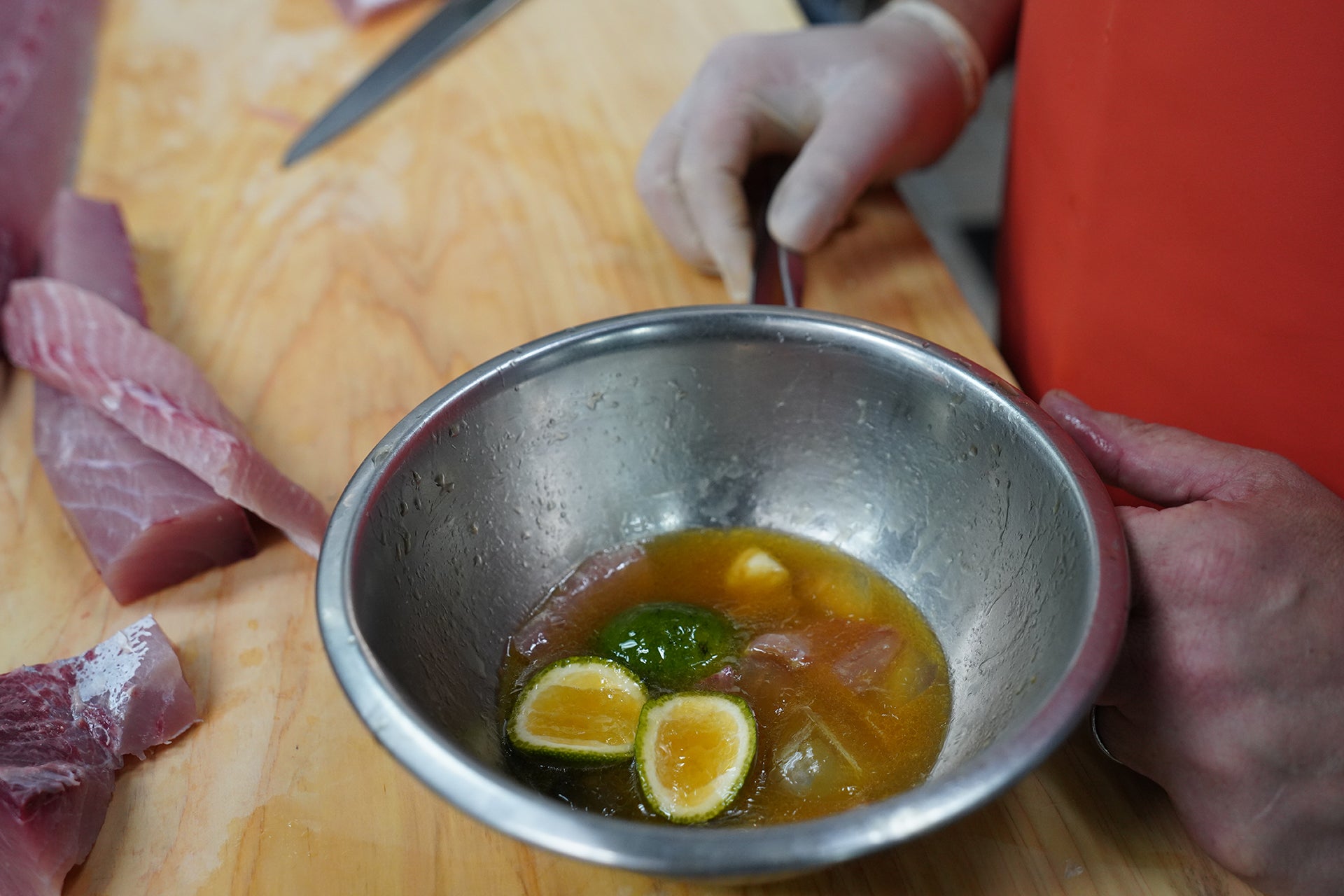 Sashimi in a bowl of marinade