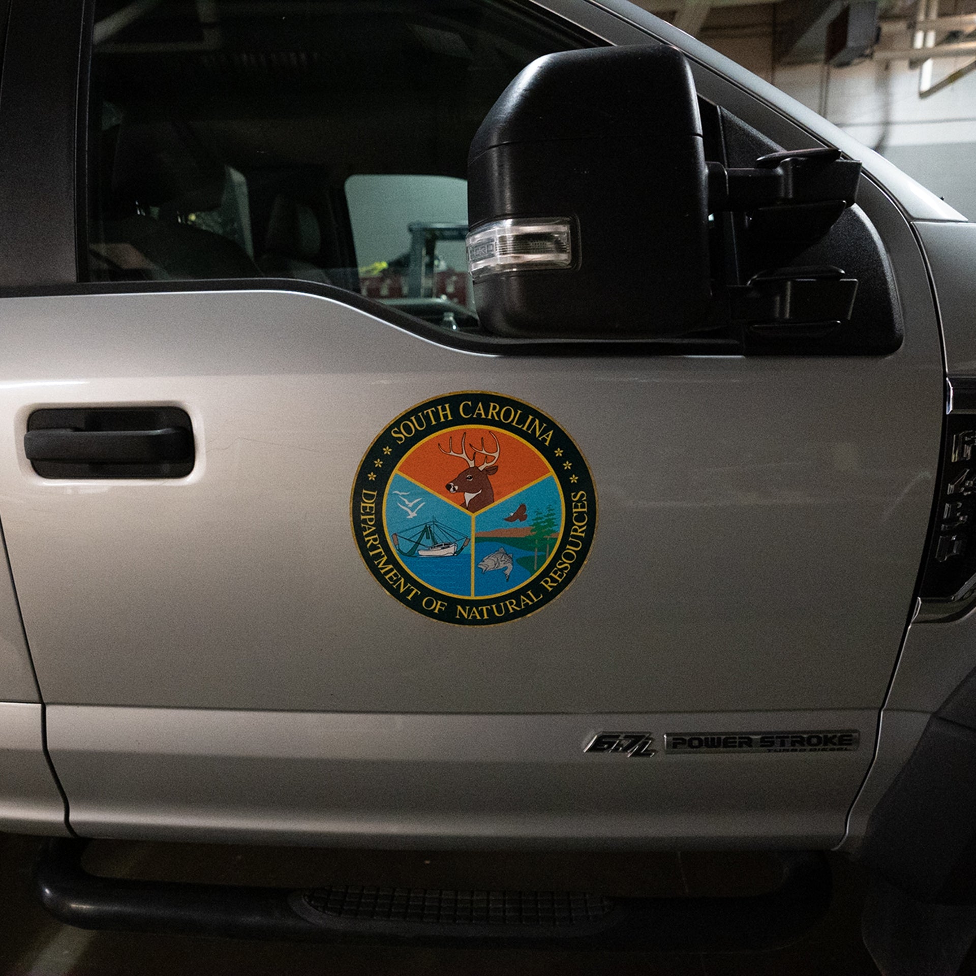 South Carolina DNR logo on a truck door