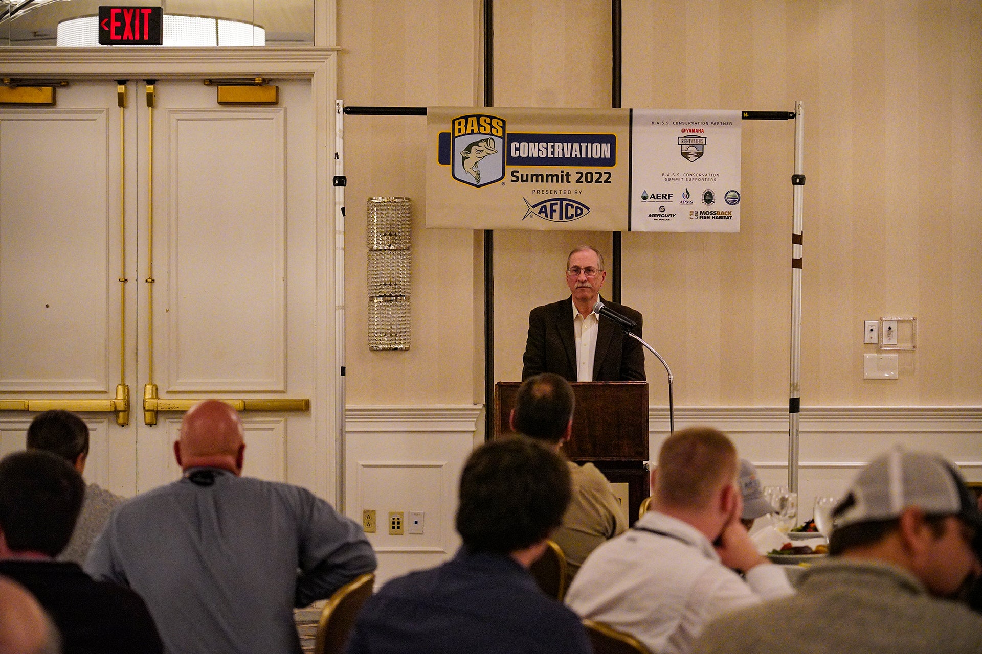 Gene Gilliland Talking to directors at a banquet