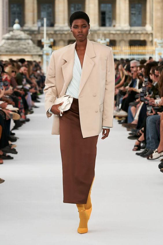 woman on runway wearing Givenchy blazer and brown skirt