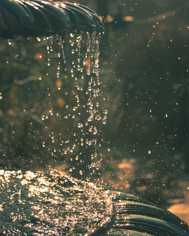 Water droplets falling off a fountain.