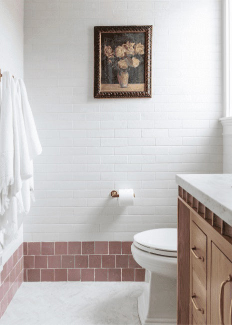 Faded light blue tile on an arched wall contrasting beige walls in Italy.