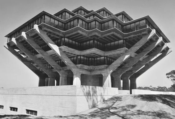 A library with two cantilevered wings over large concrete supports, and three stories elevated over the ground, with a zig-zag layout.