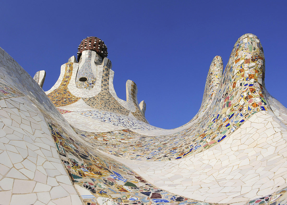 An organic, swooping shaped roof covered in tile.