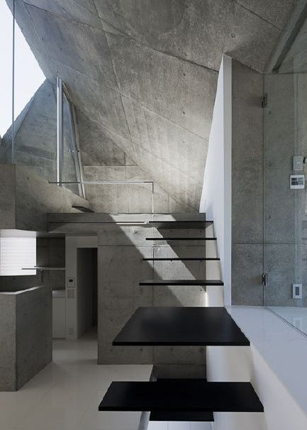 Floating stairs in a concrete house.