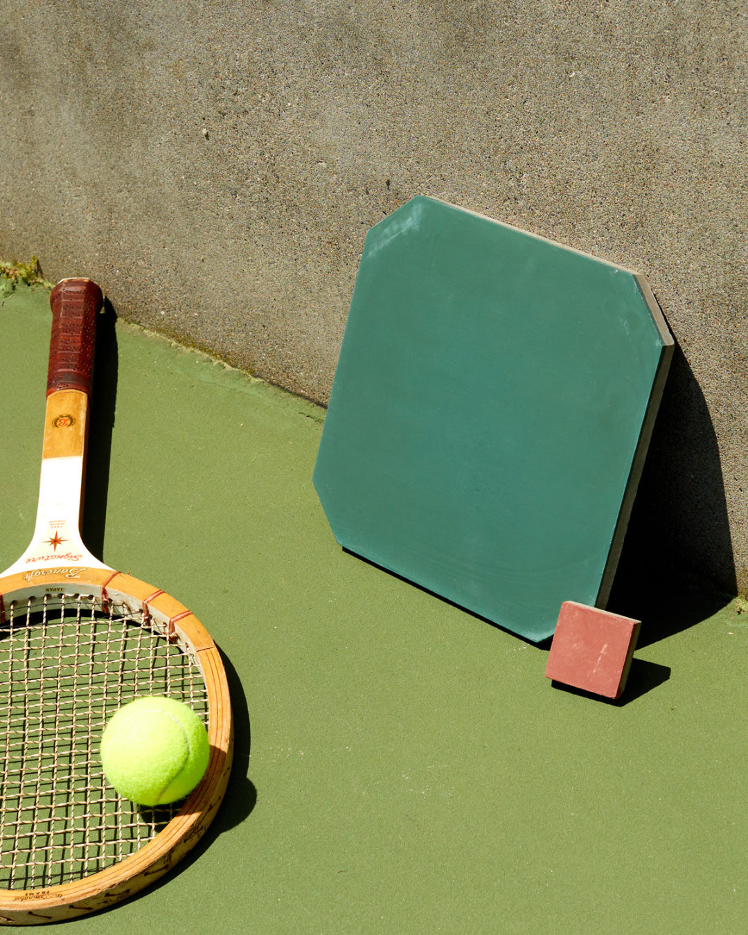 Concrete tiles styled on a tennis court.