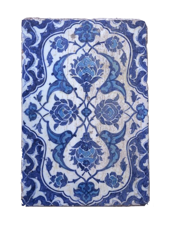 Antique blue and white patterned tiles with an intricate floral motif.