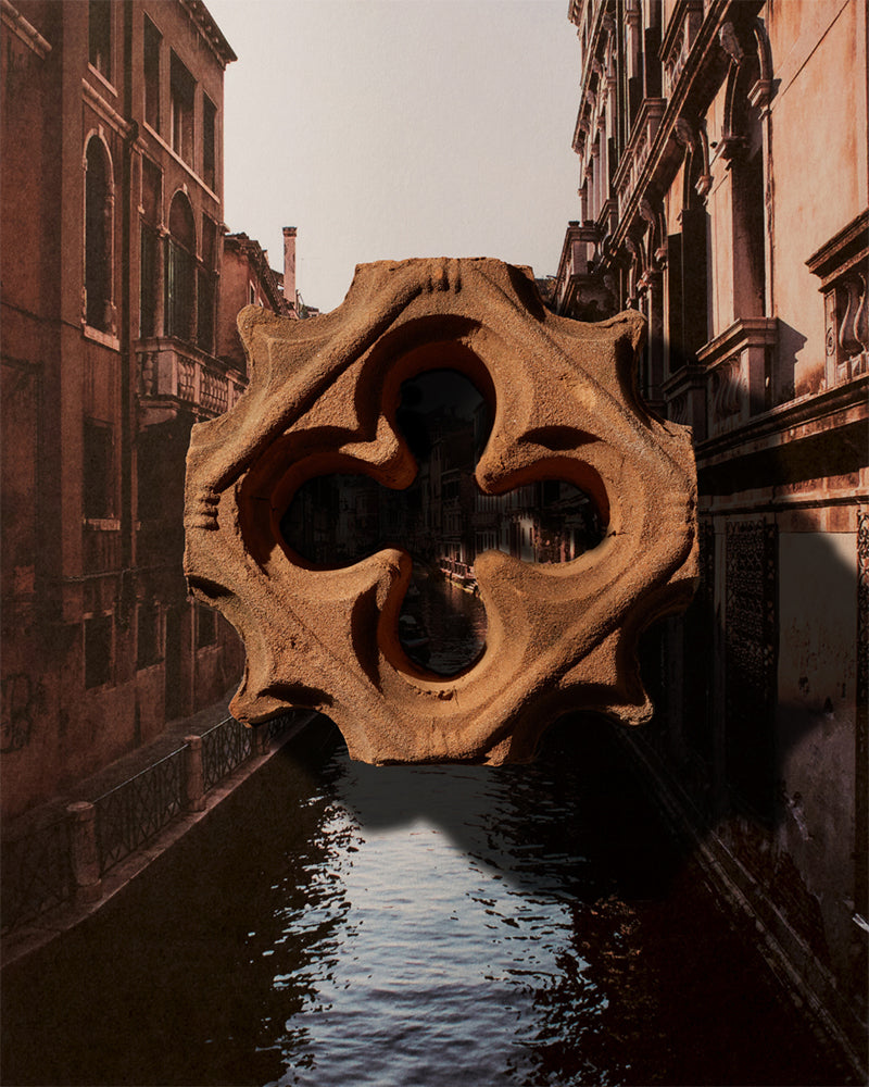 An ornate breezeblock in front of an inspiration image of Venice, Italy.