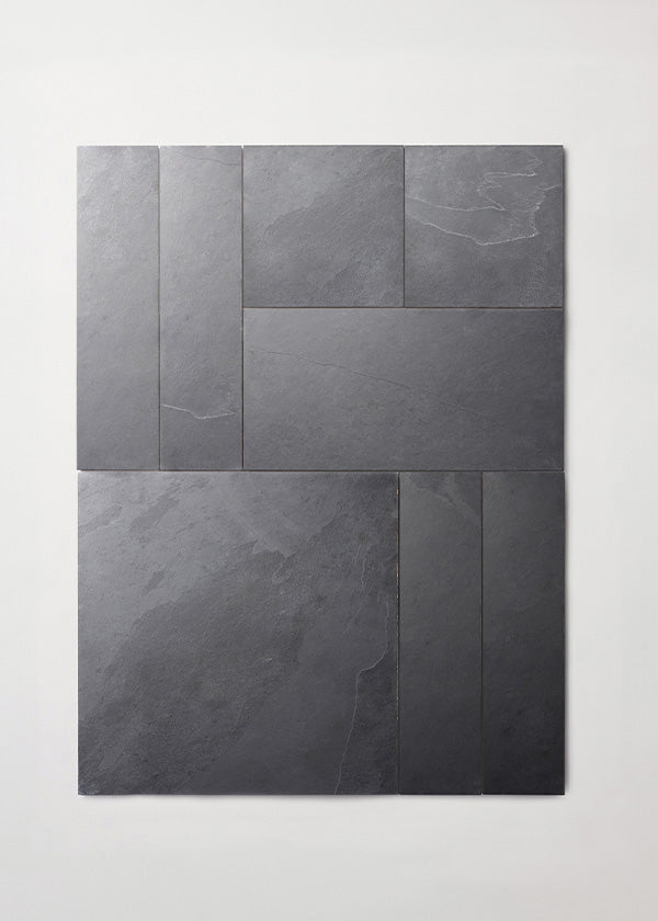 Bundle of varied sizes of slate tile arranged in a neat rectangle.