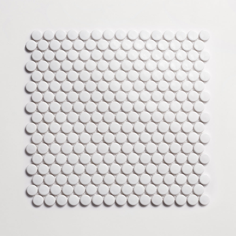 Sheet of glossy white porcelain penny round mosaic tile against a white background.