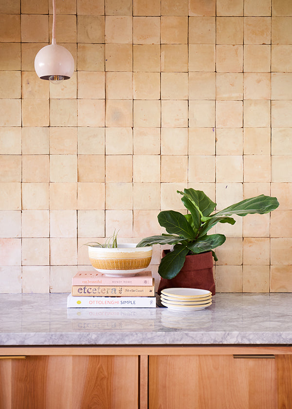 clé zellige square tiles in unglazed natural create a rustic, bohemian kitchen backsplash