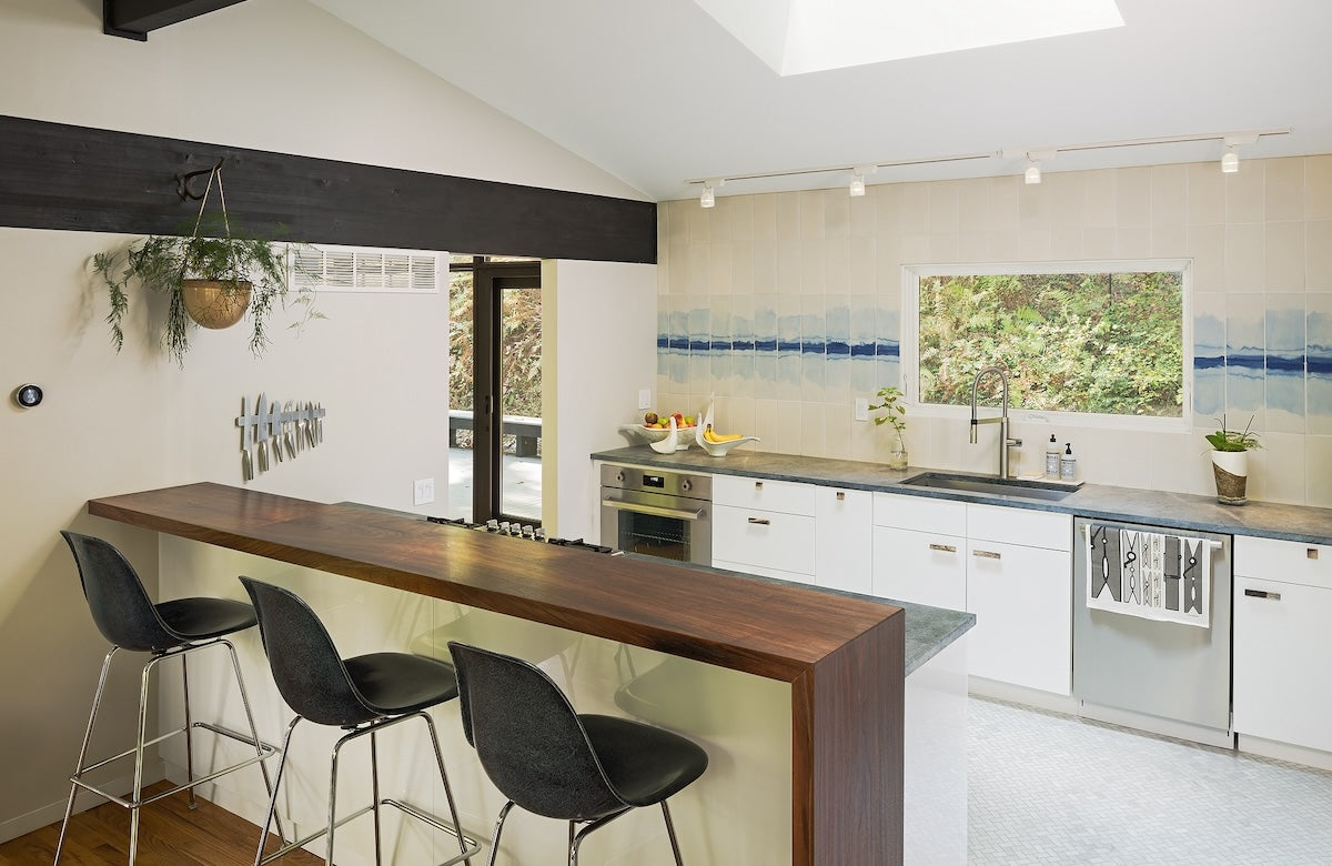 earth inspired kitchen with shibori porcelain tile backsplash and wooden countertop