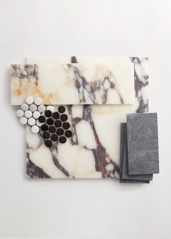 Selection of natural marble, rectangular slate, and penny round tiles against white background.