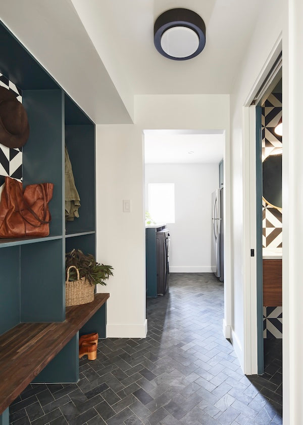 modern mudroom with slate plank floor tile in a herringbone pattern