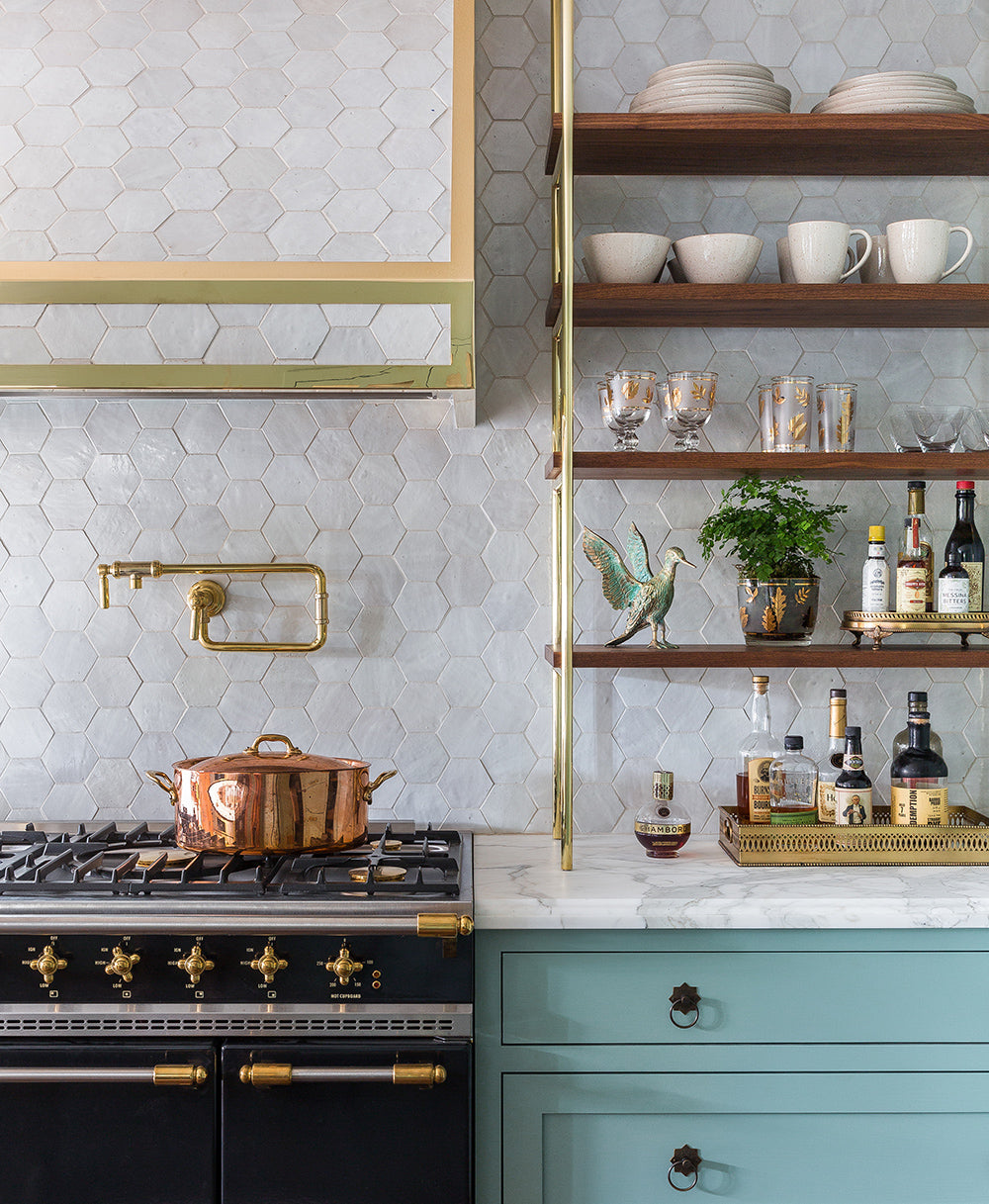 a contemporary kitchen features clé zellige hexagon tiles in weathered white on the kitchen backsplash