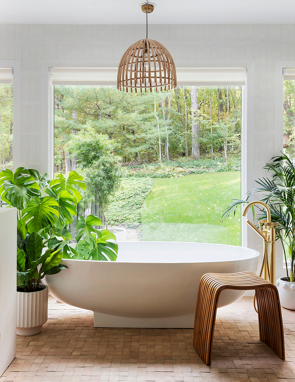 a bohemian bathroom with clé zellige square tiles in unglazed natural installed on the bathroom floor