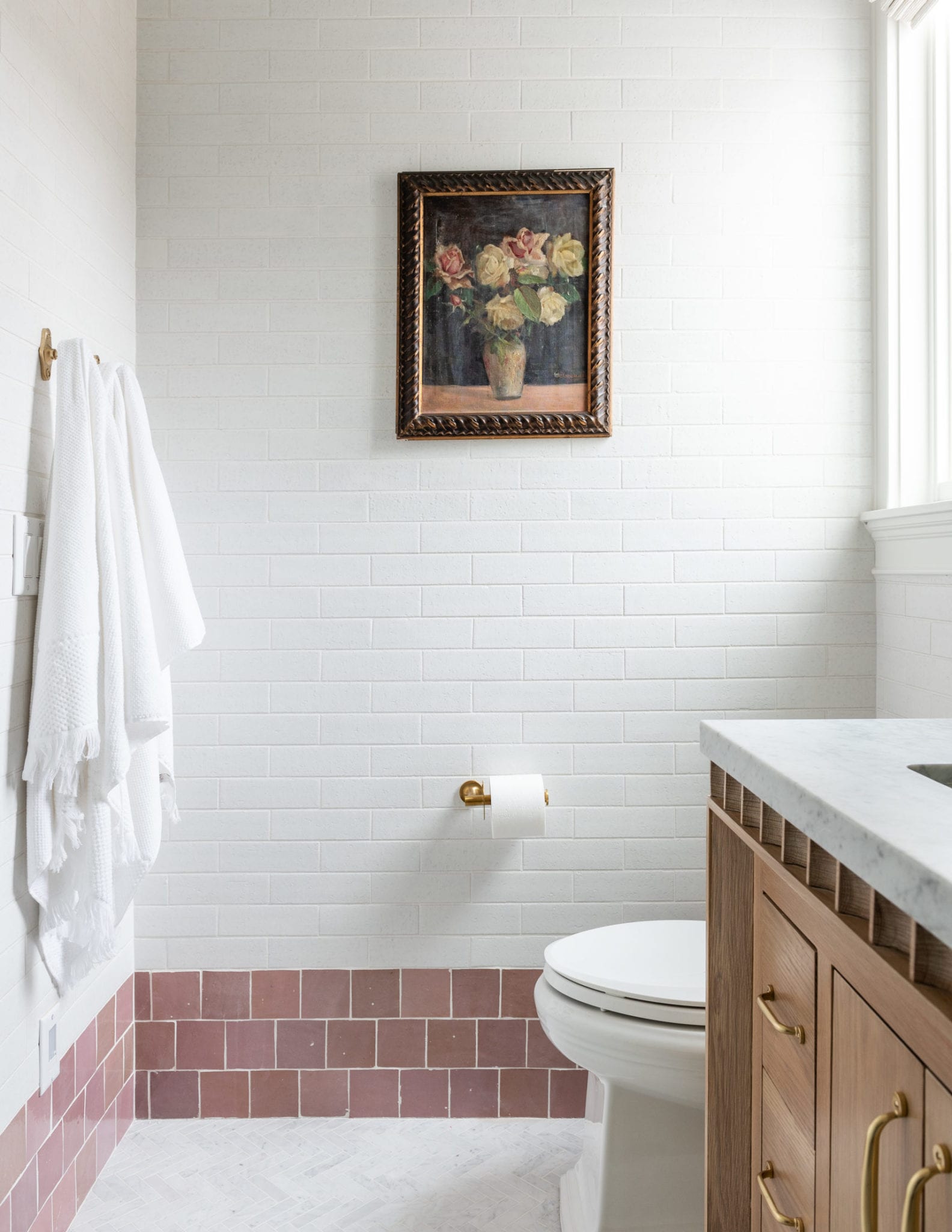 Bathroom with pink and white tile.