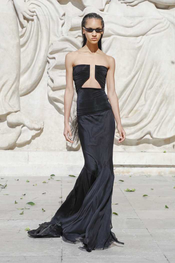 A minimalistic black gown with a structured bodice.e