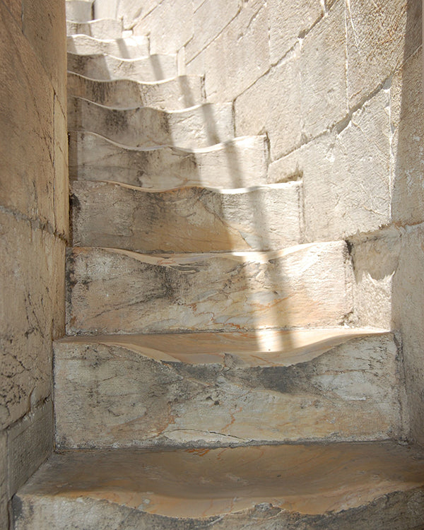 solid steps in the tower of pisa with indents worn in where people have stepped