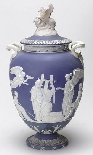 A blue and white vase in the style of a Greek greek amphora, but from England in 1789.