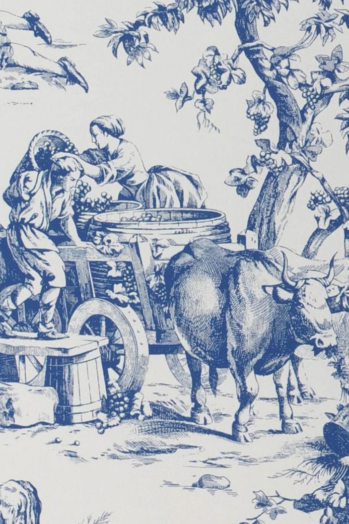 A toile pattern shows people working a vineyard with an ox.
