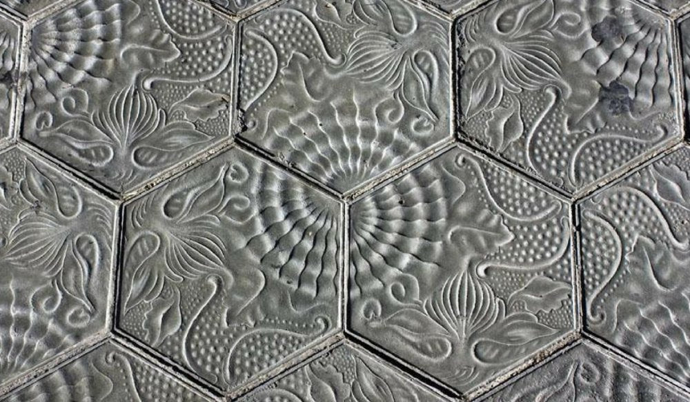 Grey hexagonal concrete tiles.
