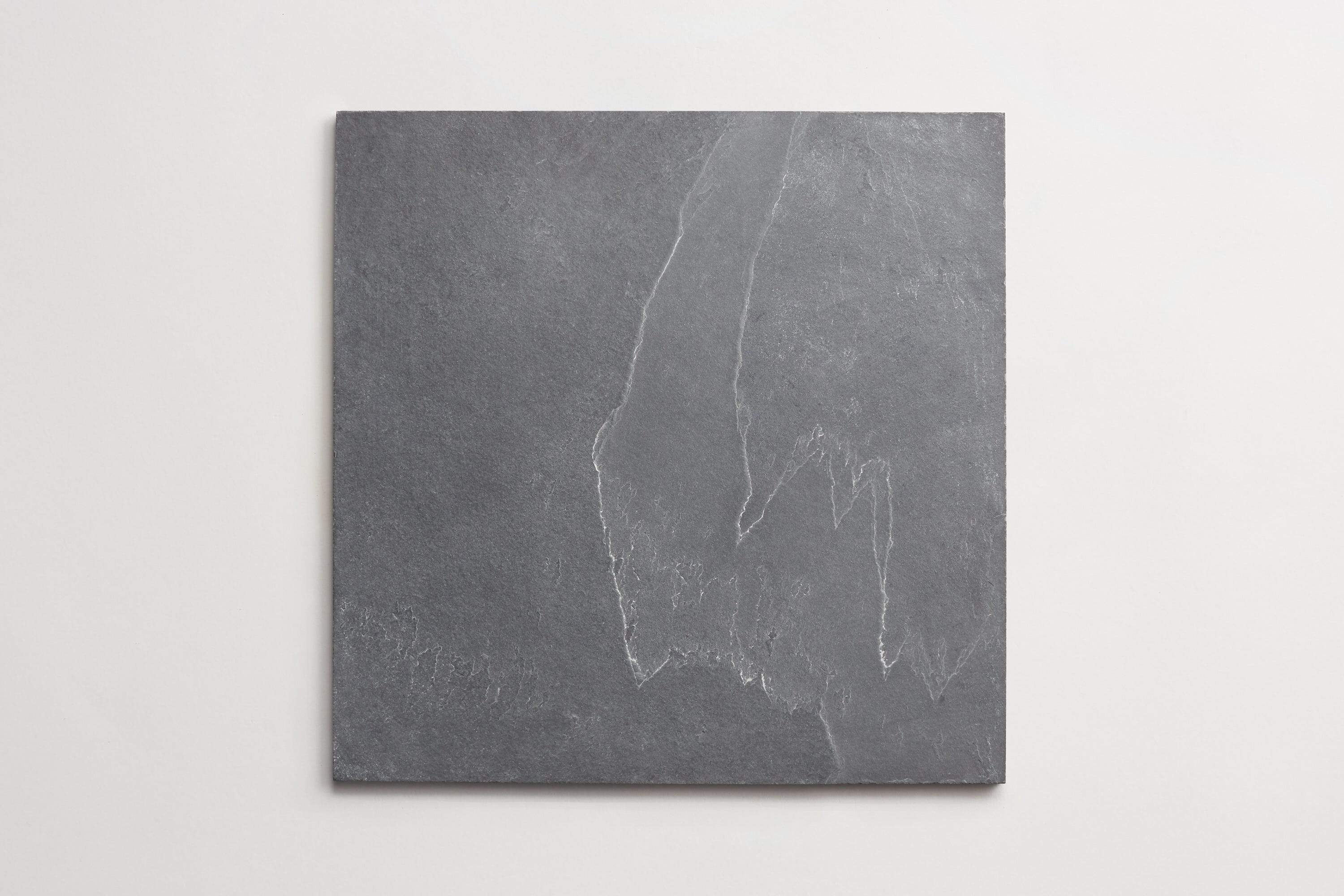 12 by 12 inch square natural slate stone tile against a white background.